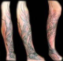 Tatuaje de un árbol en la pierna
