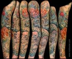 Tatuaje de una selva frondosa en el brazo
