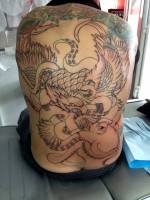 Tatuaje de un águila luchando contra un pulpo