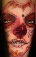 Tattoo de una chica pintada de calavera mexicana