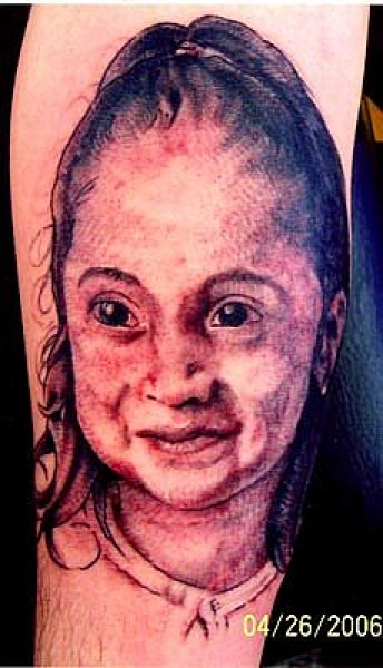 Tatuaje, retrato de una cara