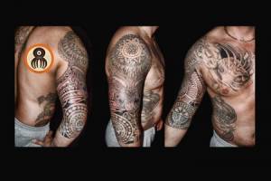 Tatuaje maori en el brazo, con un mandala en el hombro