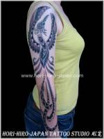 Tatuaje de Fénix tribal Maorí en el brazo