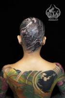 Tatuaje en la cabeza de un dragón