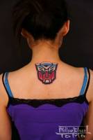 Tatuaje de Transformer en la espalda