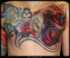 Tatuaje de un corazón y un monstruo ensangrentado