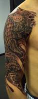 Tattoo de koi en el brazo