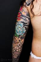 Tatuajes de flores de loto japonesas en el brazo