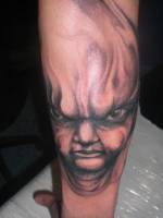 Tattoo de una cara monstruosa