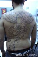 Tattoo de un Fénix en la espalda