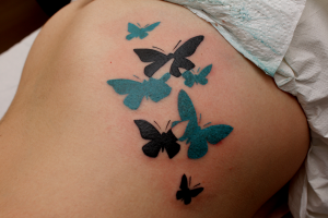 Tatuaje de varias mariposas
