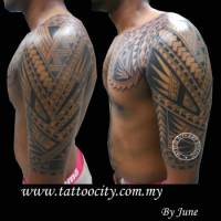 Tattoo filipino en el brazo y pecho