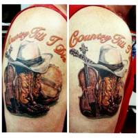 Tattoo de un sombrero vaquero con unas botas, un violín y un banjo