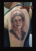 Tatuaje de un retrato en el brazo