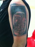 Tatuaje de una cámara de fotografiar antigua