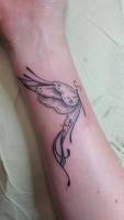Tatuaje de una mariposa en el antebrazo