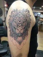 Tattoo de un león hecho mándala
